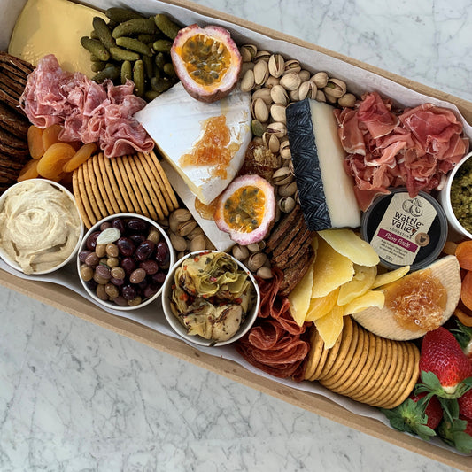 Serves up to 15 people.   Large Grazing Boxes help take the stress out of catering your next casual or formal event and suitable for a range of different occasions and includes:  Cheese - two hard, two soft Cured meat (300g two varieties - upgrade includes additional 200g) Dip - two variations Antipasti items, dried and fresh fruit (assorted) Including a substantial range of high-quality, locally sourced produce consisting of premium cheese, cold meats, nuts and gluten Grazing Boxes Perth